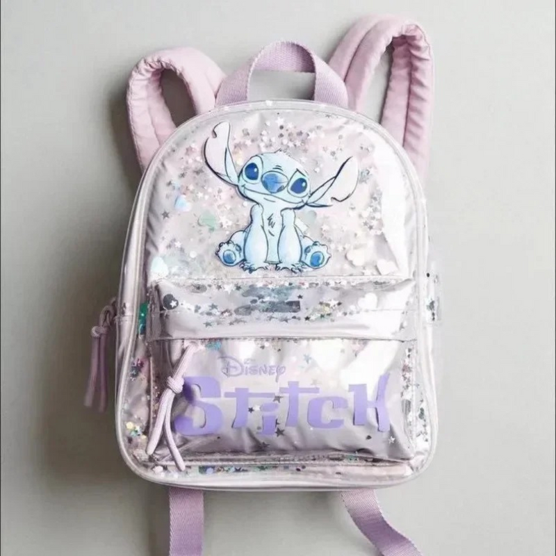 Encante sua pequena com a Mochila Escolar Disney com Lantejoulas. Feita de PVC e nylon, com zíper lilás brilhante e bolso frontal com Stitch, é ideal para o jardim de infância. Elegante, versátil e resistente.